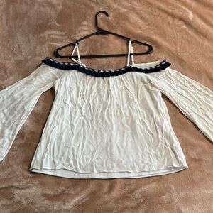 Cream with dark blue detail and fringe, cold shoulder top.